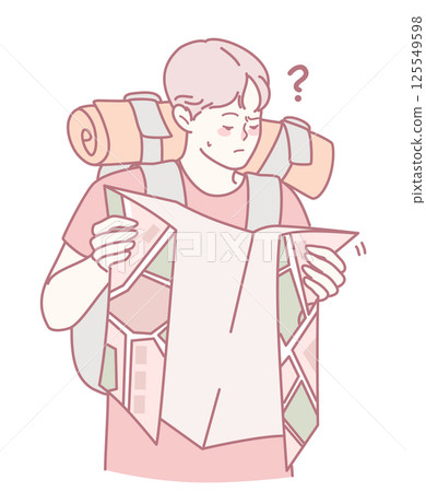 A lost hiker is intently checking their map while wearing a fully packed backpack 125549598