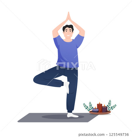 Young man practicing yoga in a serene indoor setting with candles 125549736
