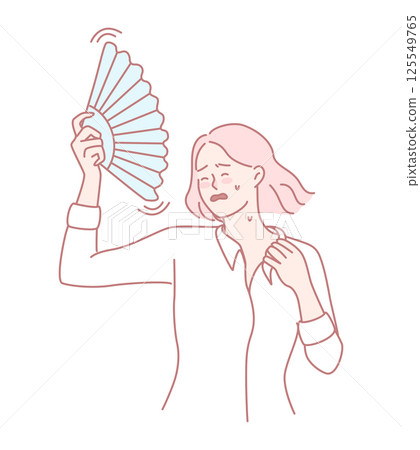 A woman is fanning herself while enjoying the warm weather on a beautiful day outside 125549765