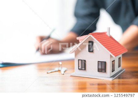 Investing in a home requires careful financial planning, including obtaining a mortgage loan and managing credit, as it signifies a significant business investment of money into a house. Investing in a home requires careful financial planning, including obtaining a mortgage loan and managing credit, as it signifies a significant business investment of money into a house. 125549797