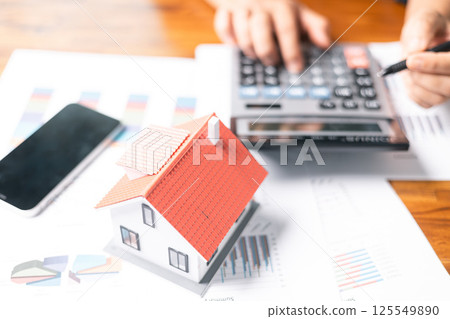 Investing in a home requires careful financial planning, including obtaining a mortgage loan and managing credit, as it signifies a significant business investment of money into a house. Investing in a home requires careful financial planning, including obtaining a mortgage loan and managing credit, as it signifies a significant business investment of money into a house. 125549890