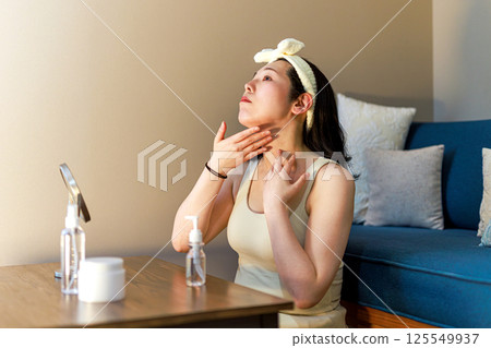 A middle-aged woman who does skin care A middle-aged woman who does skin care 125549937