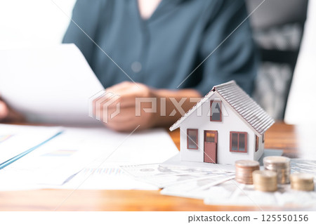 Mortgage loan is crucial part of financing home purchase, often seen as significant investment in real estate, with guidance of skilled agent ensuring sound financial decisions in the housing market. 125550156