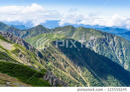 View of Mt. Nakamorimaru and Mt. Osawa from the summit of Mt. Ko-Akaishi. Southern Alps. Climbing Mt. Akaishi. 125550245