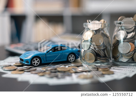 Business concept involved using finance calculator to determine premium for vehicle policy, ensuring clear financial contract for car. Investing in auto insurance can save money on transport costs. 125550712
