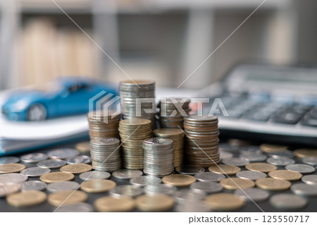 Business concept involved using finance calculator to determine premium for vehicle policy, ensuring clear financial contract for car. Investing in auto insurance can save money on transport costs. Business concept involved using finance calculator to determine premium for vehicle policy, ensuring clear financial contract for car. Investing in auto insurance can save money on transport costs. 125550717