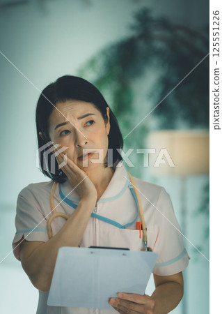 Night shift nurse in her 50s Night shift nurse in her 50s 125551226