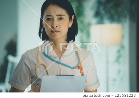 Night shift nurse in her 50s 125551228