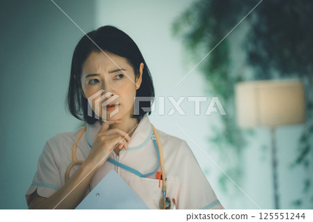 Night shift nurse in her 50s Night shift nurse in her 50s 125551244