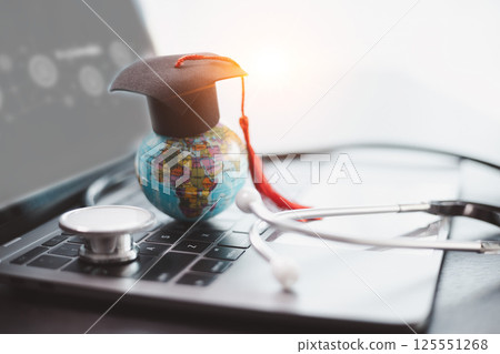 Surrounded by medical books and equipped with stethoscope, embodying years of education and dedication to providing quality health care. Concept of studying medical education. doctor, medicine. Surrounded by medical books and equipped with stethoscope, embodying years of education and dedication to providing quality health care. Concept of studying medical education. doctor, medicine. 125551268