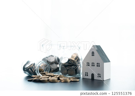 Concept of mortgage involves securing loan to finance purchase of property, allowing individuals to invest in house and potentially grow business through home ownership. loan, finance, home, money. 125551376