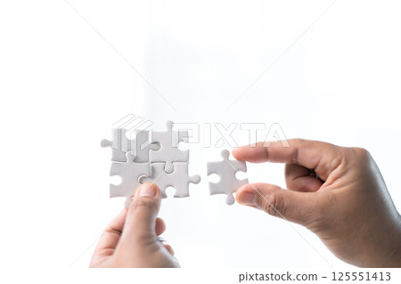 Developing strategic approach to each challenge in business is like piecing together jigsaw puzzle, solution fits into place with careful planning and steady hand, ultimately leading to success. 125551413