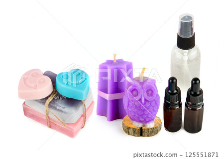 Lavender candle, soap, oil and lotion, isolated on white background. Free space for text. Collage. Lavender candle, soap, oil and lotion, isolated on white background. Free space for text. Collage. 125551871