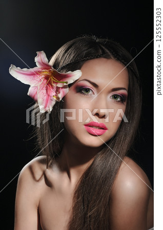 beauty with orchid in a dark beauty with orchid in a dark 125552303