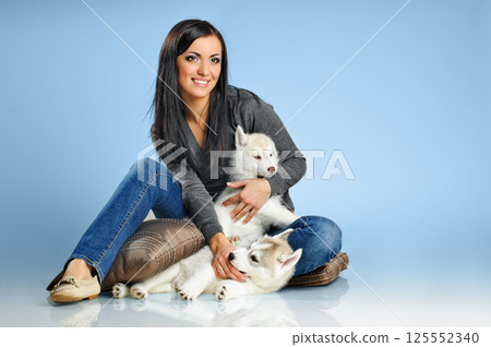woman and puppies woman and puppies 125552340