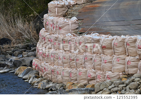 Disaster image (flood damage, heavy rain disaster, restoration, river construction, bank protection construction) 125552395