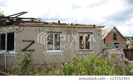 View to destroyed residential buildings at Kharkivska oblast. Ruined houses after bomb attacks on ukrainian territory from russia army. Consequences of russian invasion of Ukraine. Slow motion 125552461