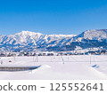 Snow-covered mountains and villages 125552641