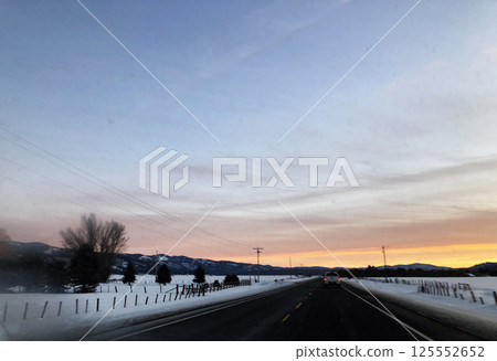 Sunset on road from Brundage Mountain ski resort. View from car. 125552652