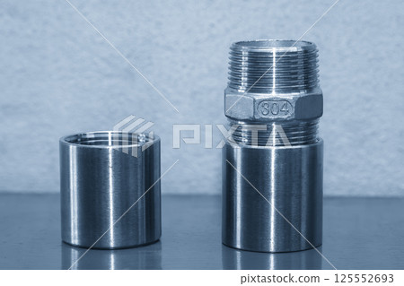 The stainless steel pipe connector in the light blue scene. 125552693