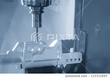 The 5-axis CNC milling machine cutting the aerospace part with solid ball end mill tool in the light blue scene. The 5-axis CNC milling machine cutting the aerospace part with solid ball end mill tool in the light blue scene. 125552697