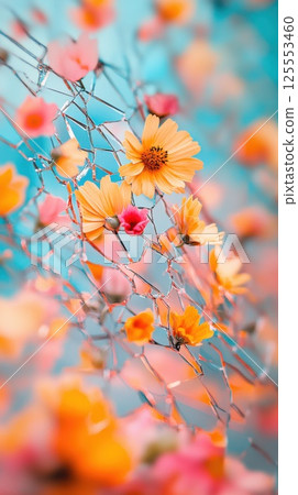 Shattered mirror reflects vibrant flowers blooming from cracks in bright light 125553460