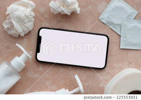 Mockup for adult content website or app on smartphone display with porn watching attributes for masturbation. Copy space 125553931