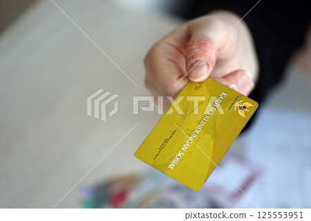 Indonesian golden social security card originally called Kartu perlindungan sosial. Card for financial support 125553951