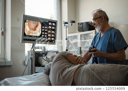 Gastroscopy procedure on sedated patient to examine upper digestive tract. Gastroscopy procedure on sedated patient to examine upper digestive tract. 125554009