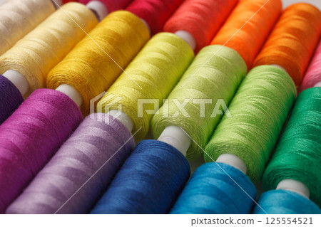 Set of colorful spools of thread 125554521