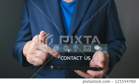 professional touch with a virtual Contact Us interface on a tablet, featuring icons for email, phone, location, and web, symbolizing modern communication and business connectivity. professional touch with a virtual Contact Us interface on a tablet, featuring icons for email, phone, location, and web, symbolizing modern communication and business connectivity. 125554760