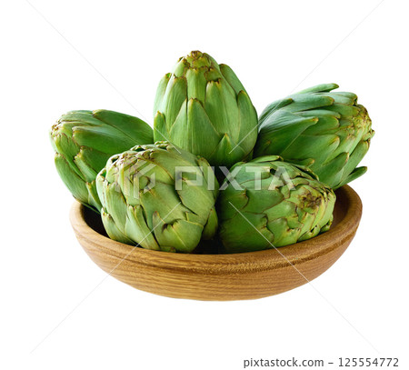 Fresh green artichoke in a wooden bowl isolated on a white background. 125554772