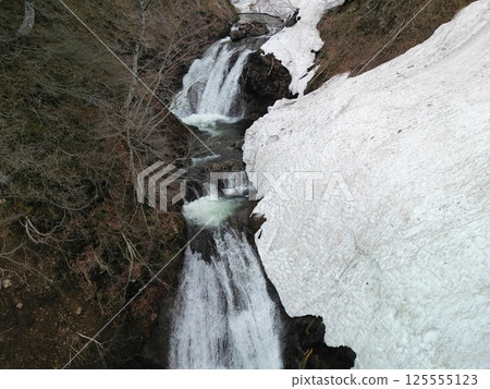 Aerial view of Yuhama Pass with remaining snow Aerial view of Yuhama Pass with remaining snow 125555123