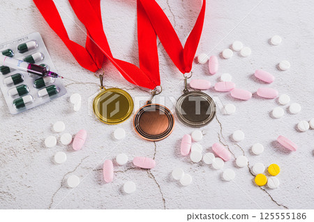 Pill and injections for doping athletes on a light background Pill and injections for doping athletes on a light background 125555186