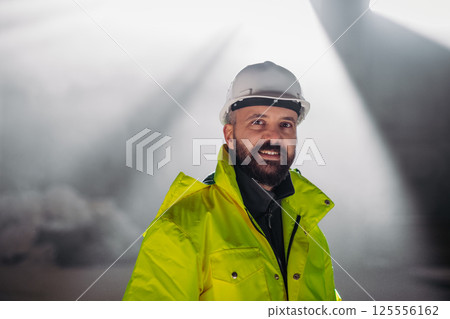 Portrait of construction foreman in modern building site. 125556162