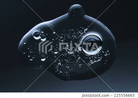 A drop of gel serum with bubbles. The texture. View from below. 125556665