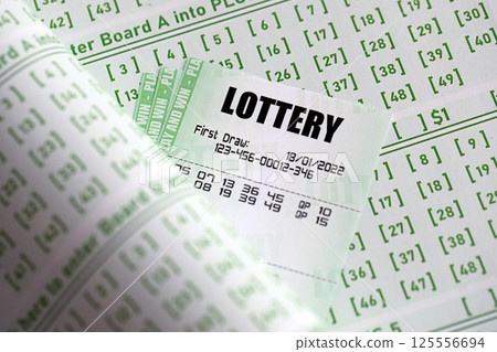 Green lottery tickets and blank bills with numbers for playing lottery Green lottery tickets and blank bills with numbers for playing lottery 125556694