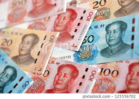 Many money bills of People Republic of China. PRC Yuan banknotes 125556702