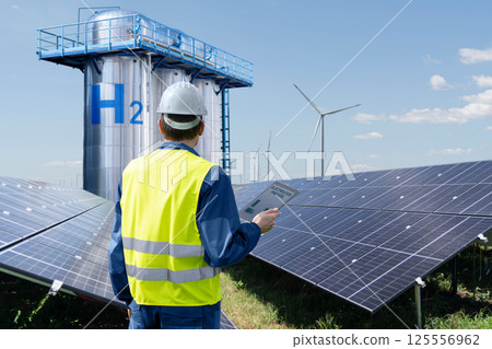 Engineer with tablet computer on a background of Hydrogen factory 125556962