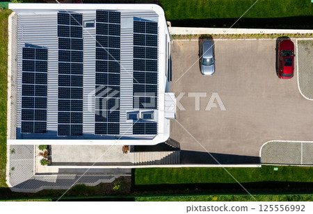 Country house with solar panels on a roof. 125556992