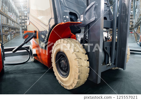Electric warehouse loader with connected charging plug 125557021