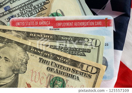Employment Authorization Card United States of America Work Permit and dollar bills on flag Employment Authorization Card United States of America Work Permit and dollar bills on flag 125557109