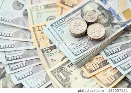 American US dollars money bills and coins close up in big amount American US dollars money bills and coins close up in big amount 125557221