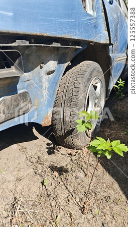 A close-up of a worn-out blue car A close-up of a worn-out blue car 125557388