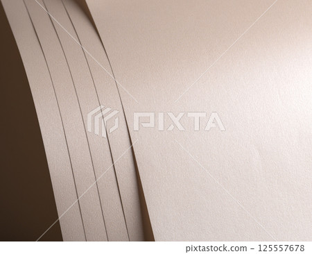 Background with satin pearlescent paper texture. Layered strips with curved contour and gentle wave 125557678