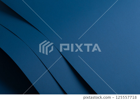 Paper background with matte texture. Layered curved sheets in navy, royal blue, deep blue, and ocean 125557718