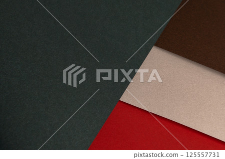Paper background with matte texture. Layered diagonal surface in crimson red, champagne, chocolate Paper background with matte texture. Layered diagonal surface in crimson red, champagne, chocolate 125557731