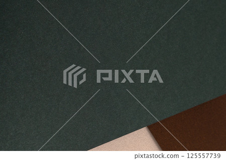 Paper background with matte texture. Layered surface in pine green and chocolate brown tones, sleek Paper background with matte texture. Layered surface in pine green and chocolate brown tones, sleek 125557739