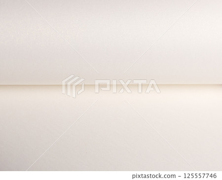 Paper background with pearlescent texture. Folded smooth surface in creamy white and ivory tones, Paper background with pearlescent texture. Folded smooth surface in creamy white and ivory tones, 125557746