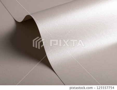 Paper background with satin pearlescent texture. Glossy folded curves, soft wave and sculptural flow 125557754
